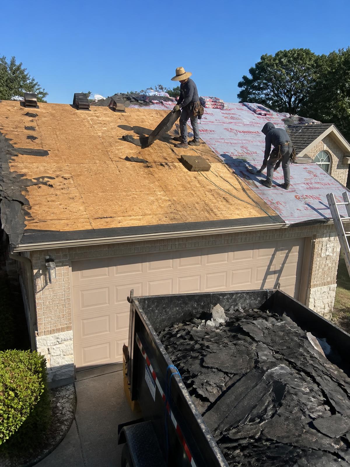 Residential Roof Replacement work in progress by the Delfi Roofing crew